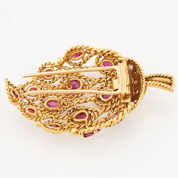 A 1950/60's brooch by Cartier, in the shape of a strawberry, set with carved rubies and brilliant cut diamonds.