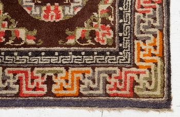A Chinese two square rug, antique, c. 142 x 71 cm.
