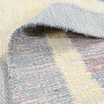 A flat weave carpet designed by Ida Rydelius from the second half of the 20th century.