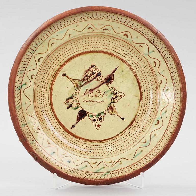 a earthenware plate dated 1831.