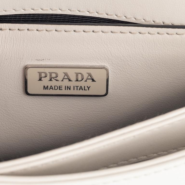 Prada, A white spazzolato leather bag.