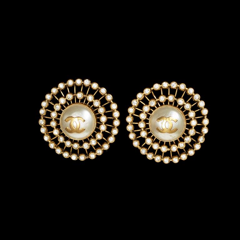 A pair of earrings by Chanel.