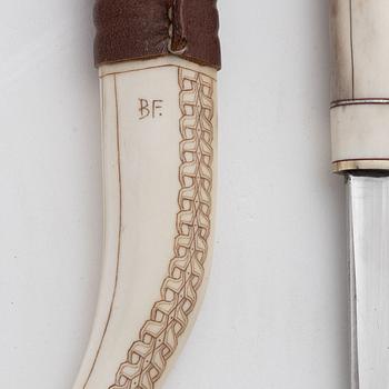 A reindeer horn knife by Bertil Fällman, signed.