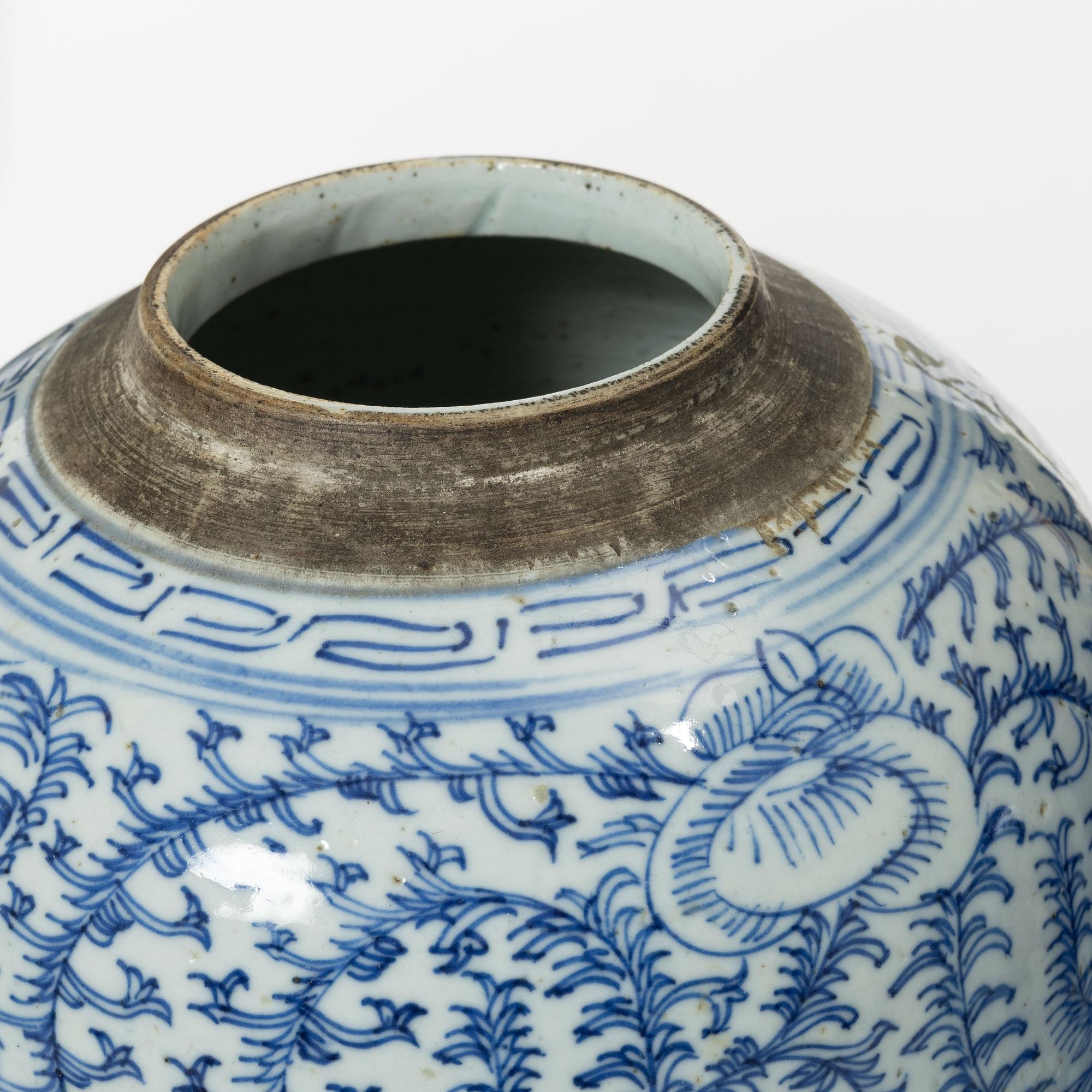 Two similar Chinese blue and white porcealin jars with wooden covers, Qing dynasty, 19th Century.