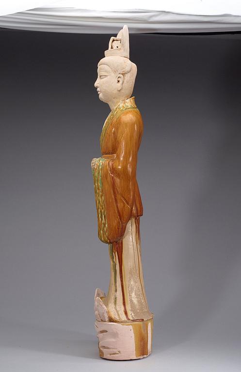 A potted, partially glazed tomb figure of a guardien, Tang dynasty (618-907).