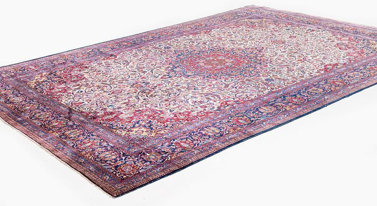 An antique silk Kashan carpet, c. 378 x 259 cm.