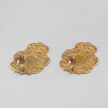 A pair of wallplates made of brass, 20th century.