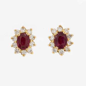 Earrings, a pair in carmosé style, with rubies and brilliant-cut diamonds.