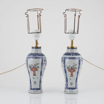 A pair of Chinese porcelain table lights/vases, 18th Century.