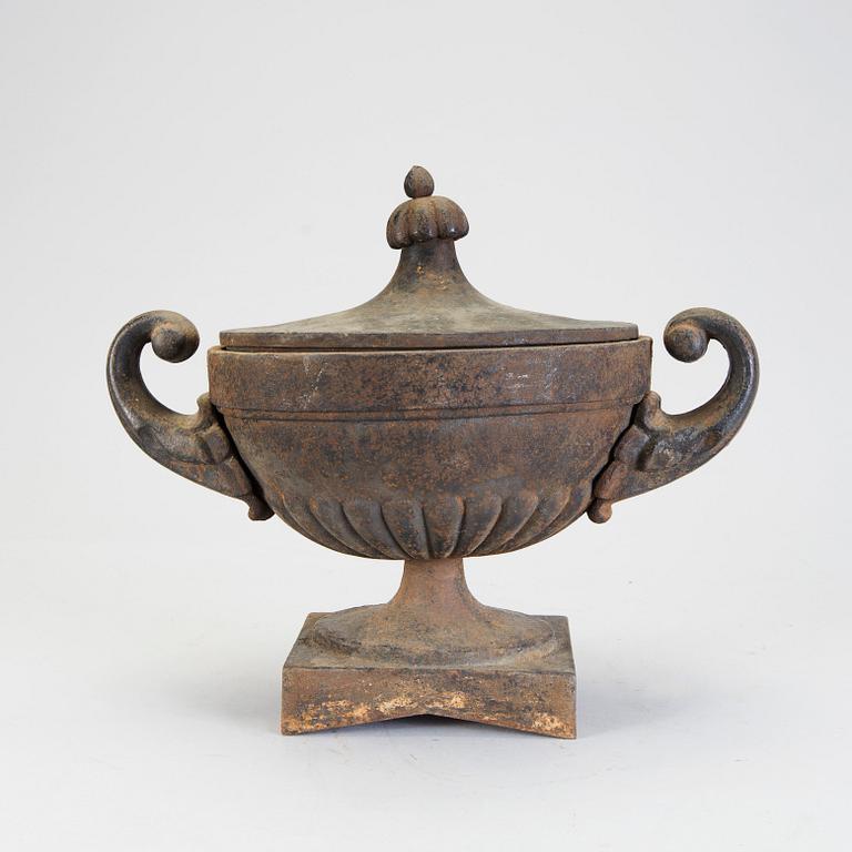 A 20th century cast iron urn.