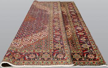 A Tabriz carpet, approximately 360 x 255 cm.