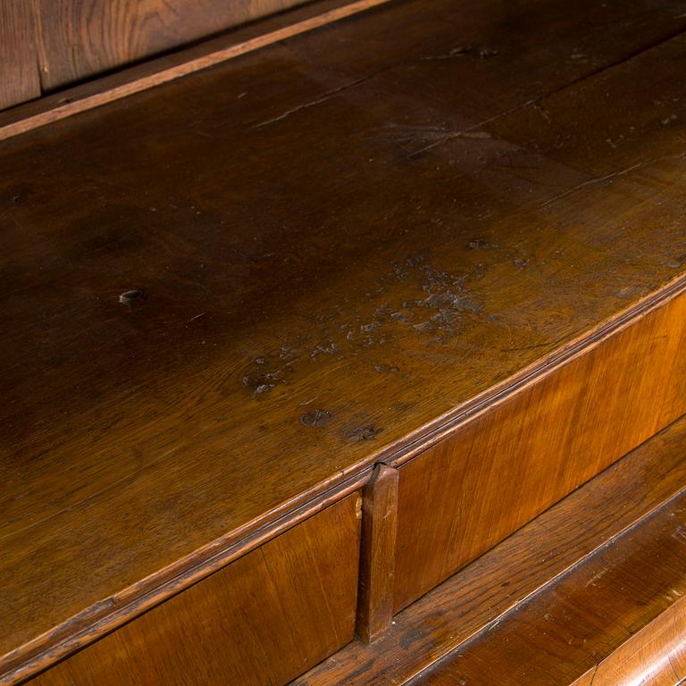 A Swedish walnut-veneered rococo cabinet in the manner of C. Linning, latter half of the 18th Century.