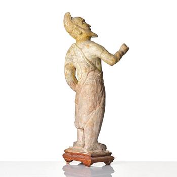 A yellow glazed potted figure of a groom, Tang dynasty (618-907).