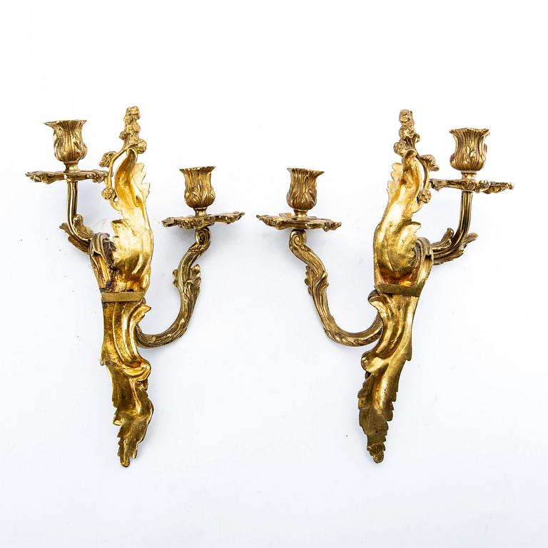 A pair of Rococo style gilded wall scones late 19th century-early 20th century.