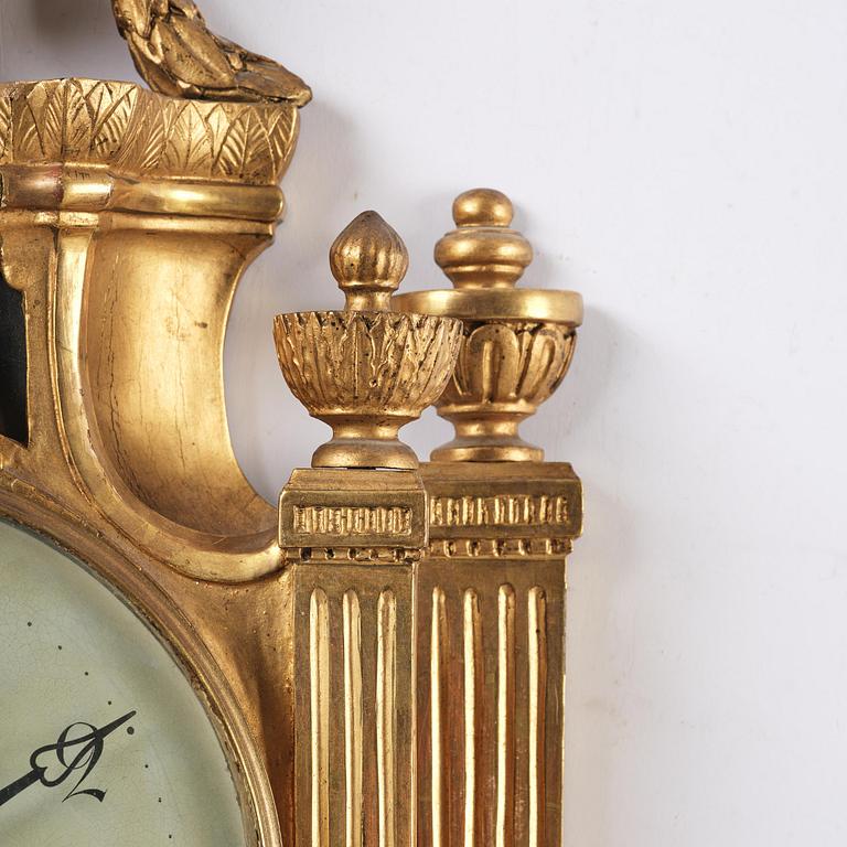 A Gustavian giltwood cartel clock by O. Ljundahl (watchmaker in Stockholm 1775-80).