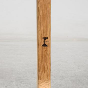 A model JH 575 coffee table by Hans J Wegner for Johannes Hansen.