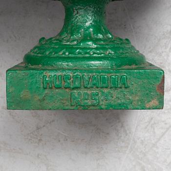 A pair of cast iron garden urns by Husqvarna, circa 1900.