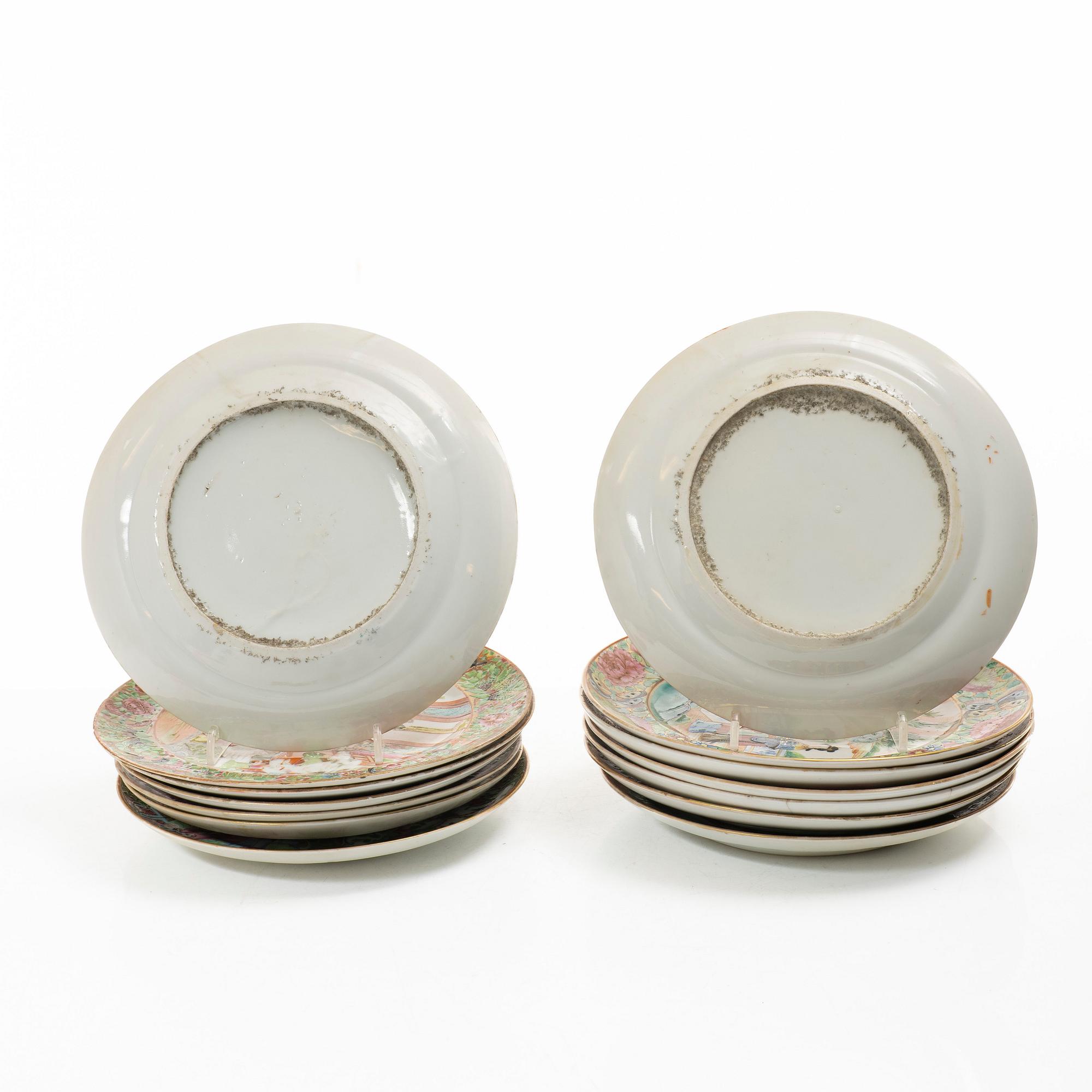 A matched set of 14 famille rose 'Canton' dinner plates, Qing dynasty, 19th century.