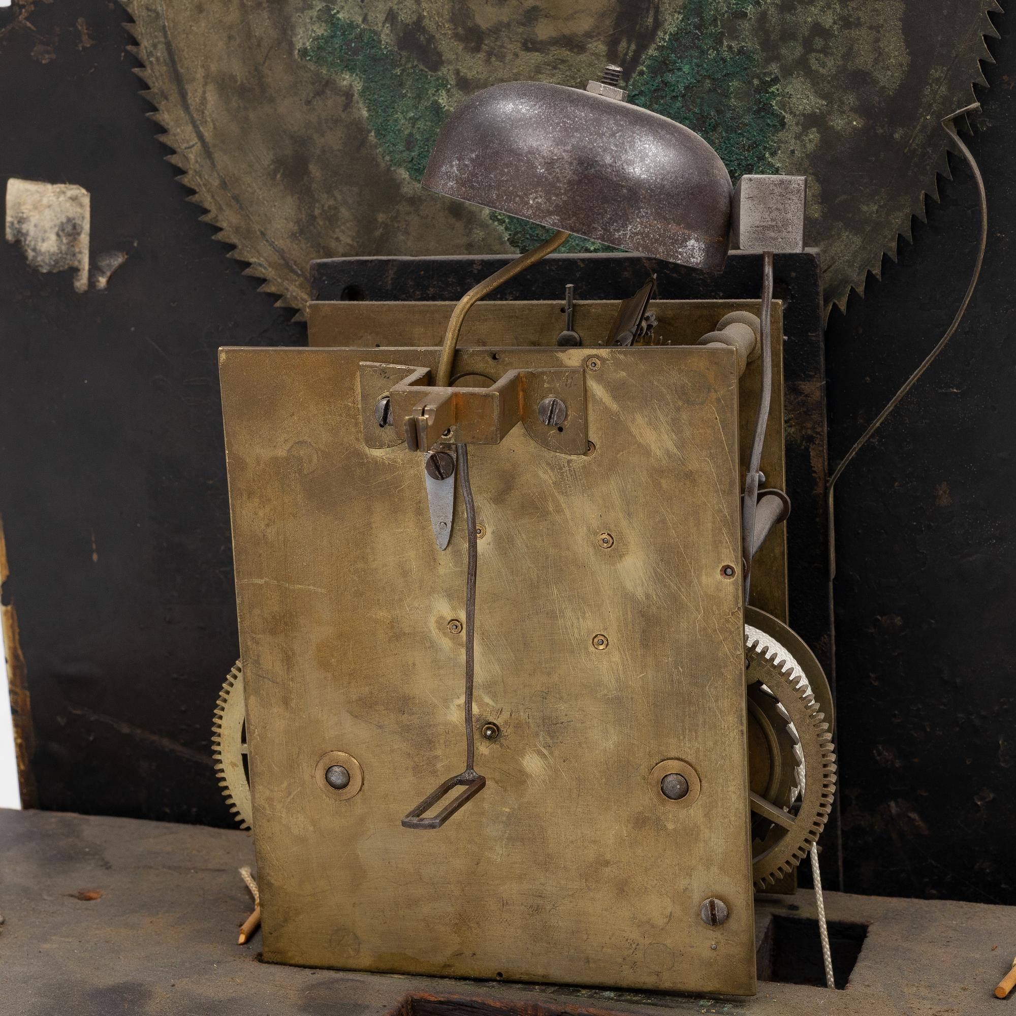 A long-case clock, England, 19th century.
