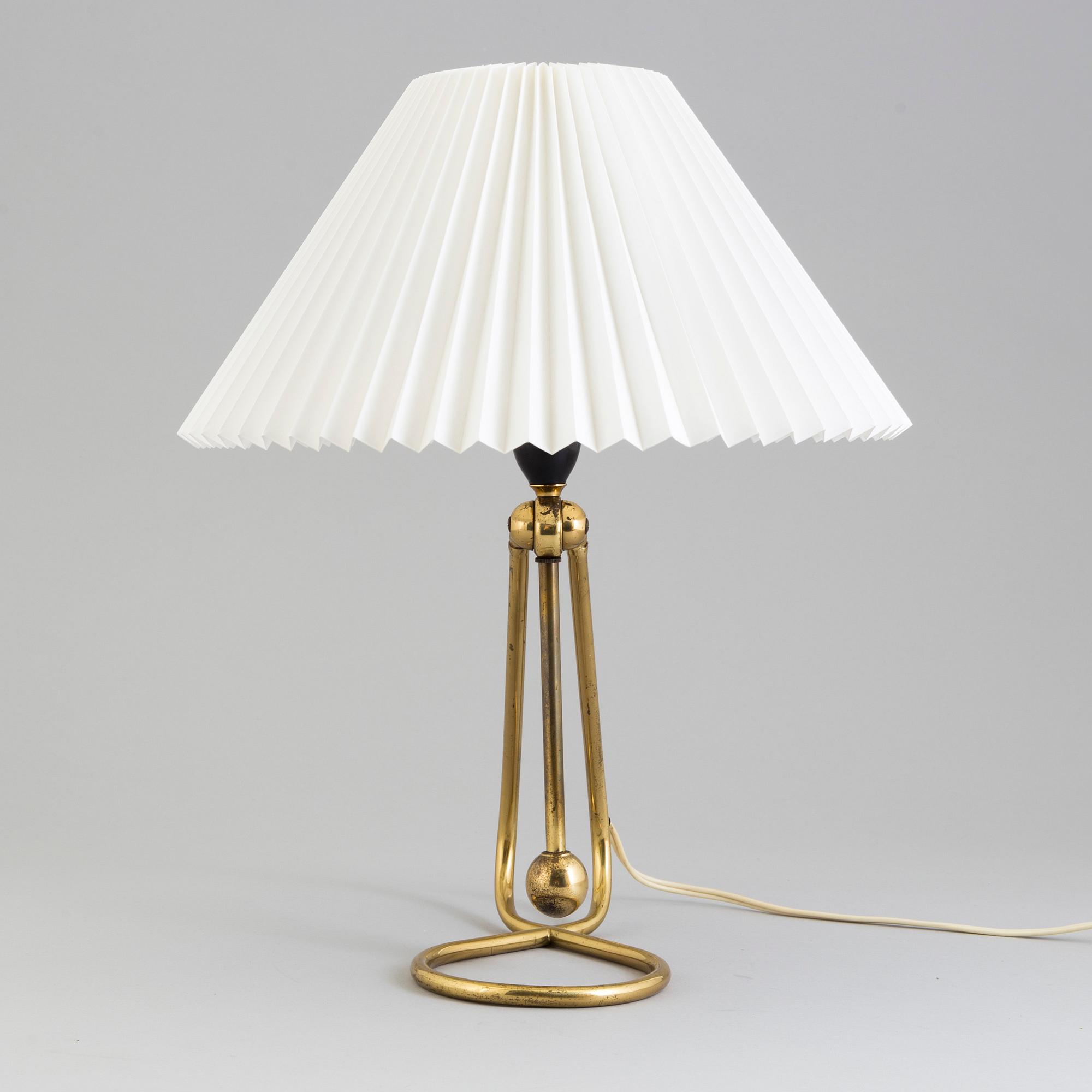 A Le Klint brass table or wall lamp.