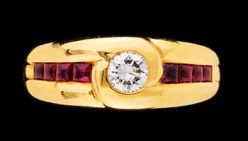 697. A gold, ruby and diamond ring.
