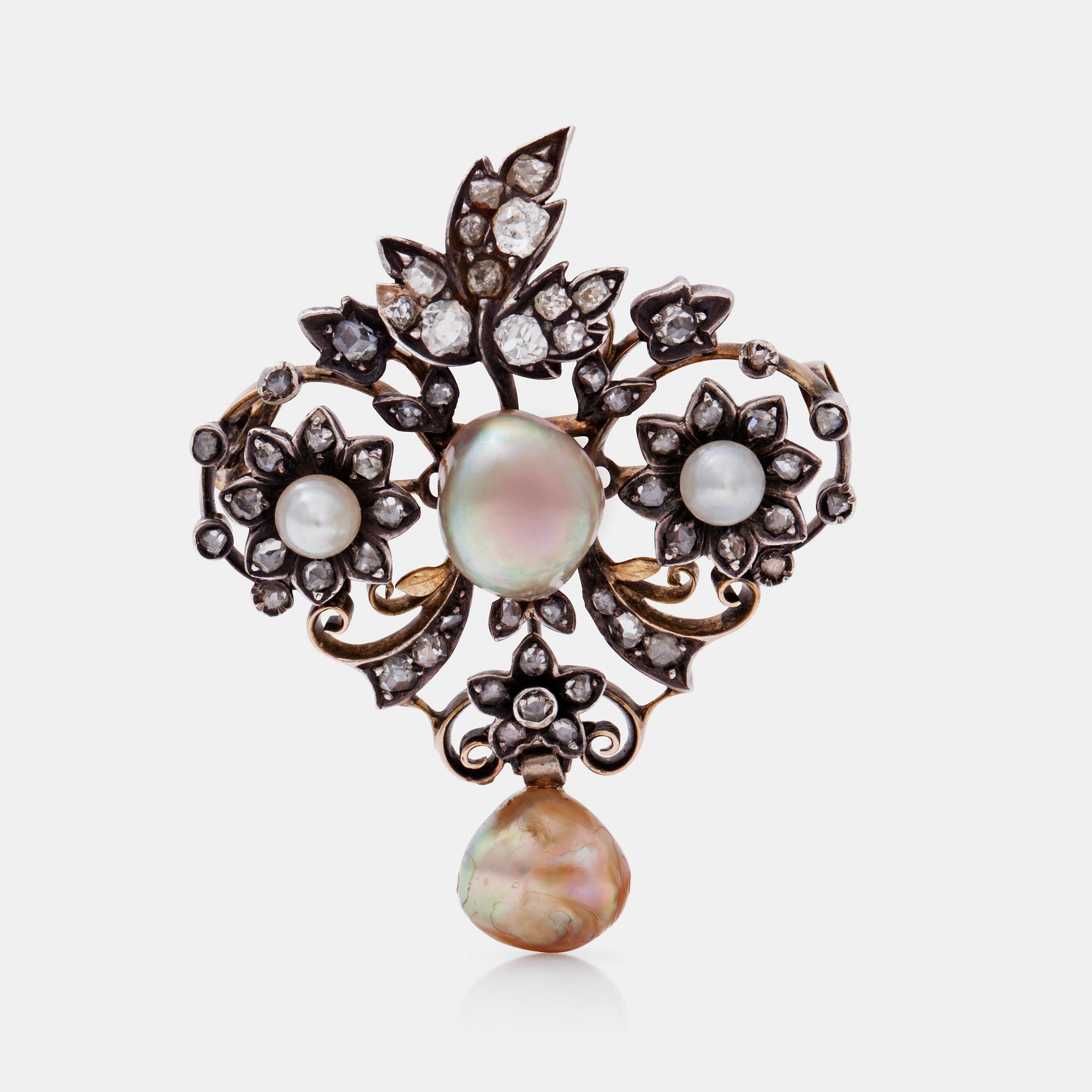A natural saltwater pearl, natural abalone pearl and diamond brooch. Certificate from GSC.