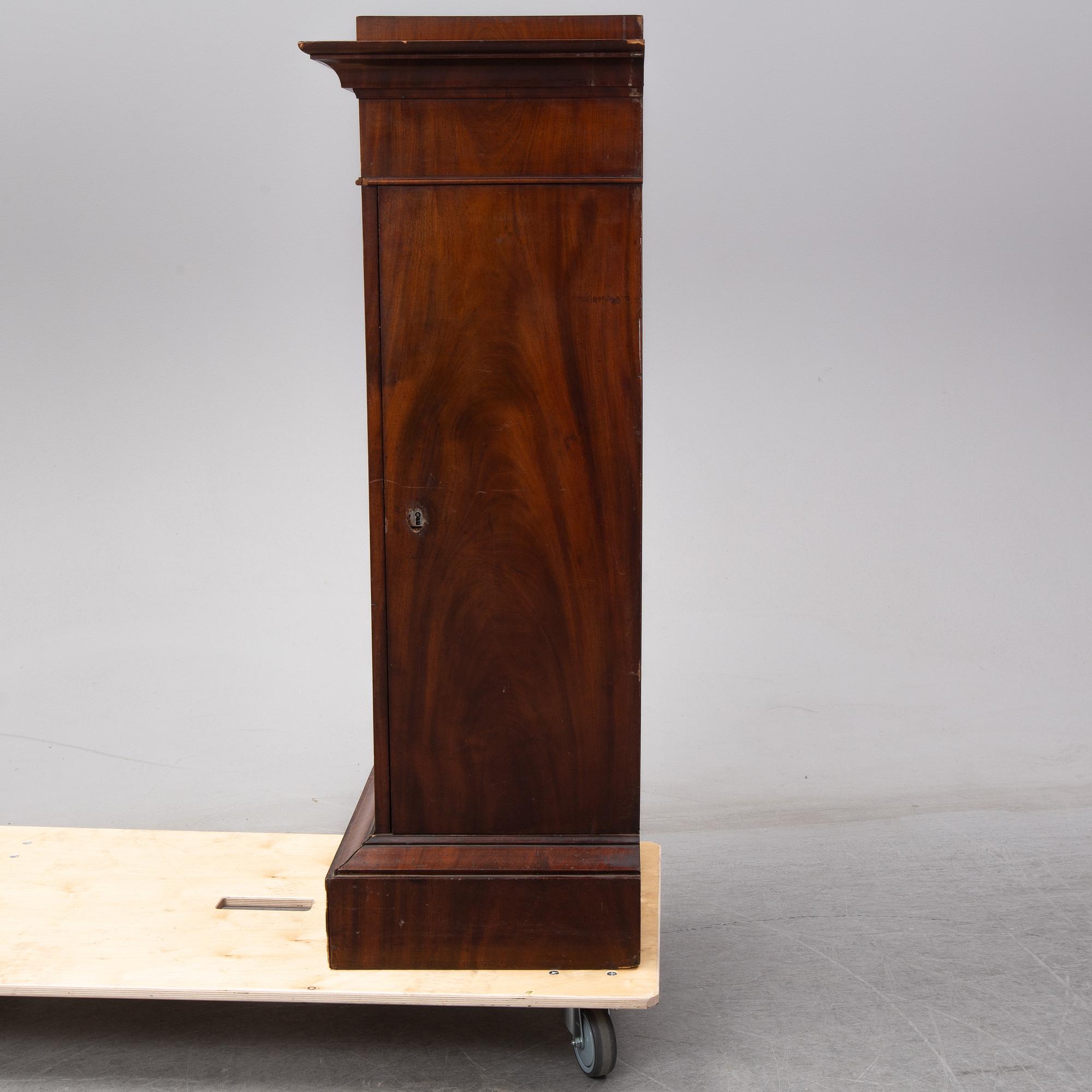An early 19th Century empire mahogany cabinet.