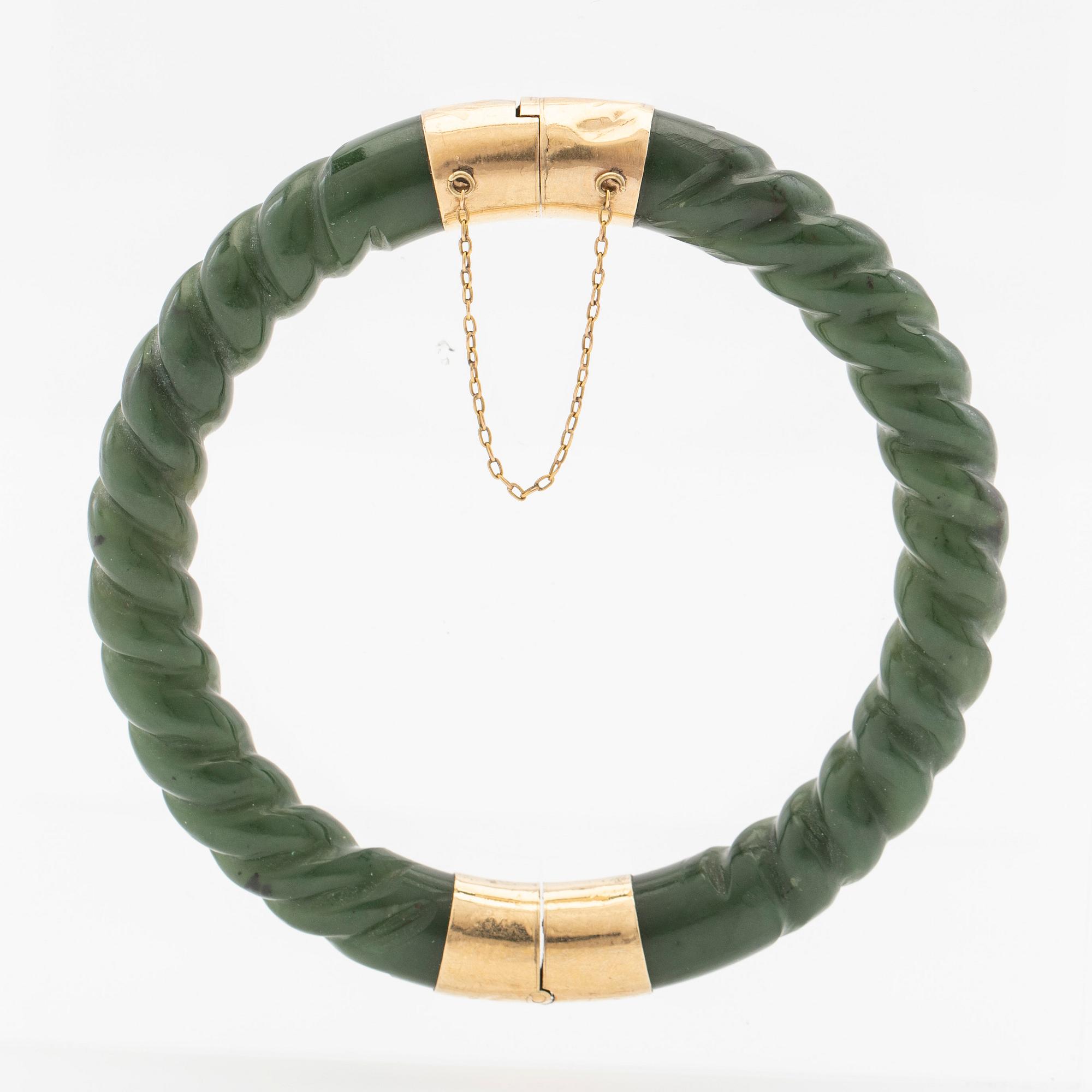 Arm ring, green stone and clasp in 14K gold.