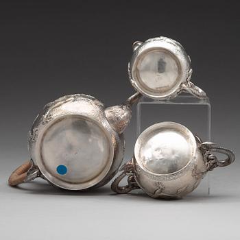 A Chinese three piece silver tea set, early 20th Century.