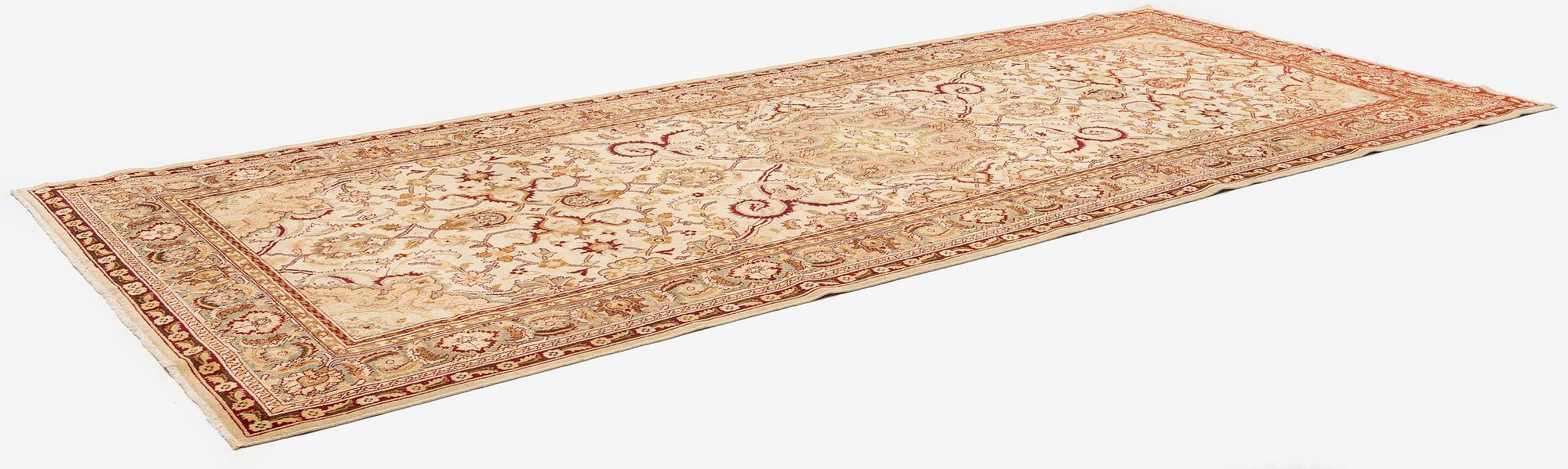 An Antique Amritsar carpet, Northern India, c. 437 x 189 cm.