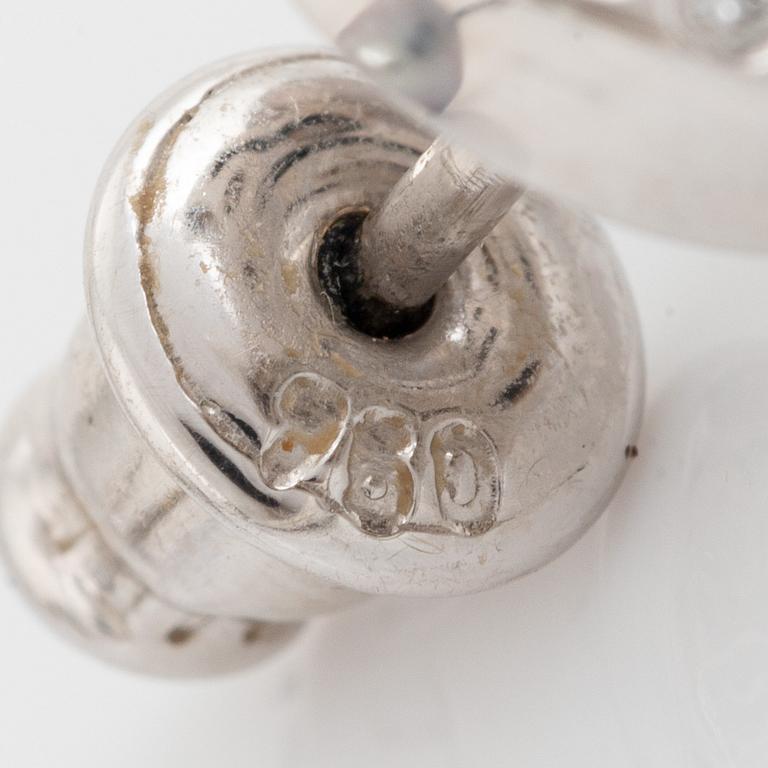 Brilliant cut diamond moon shape and cultured grey pearl earrings.