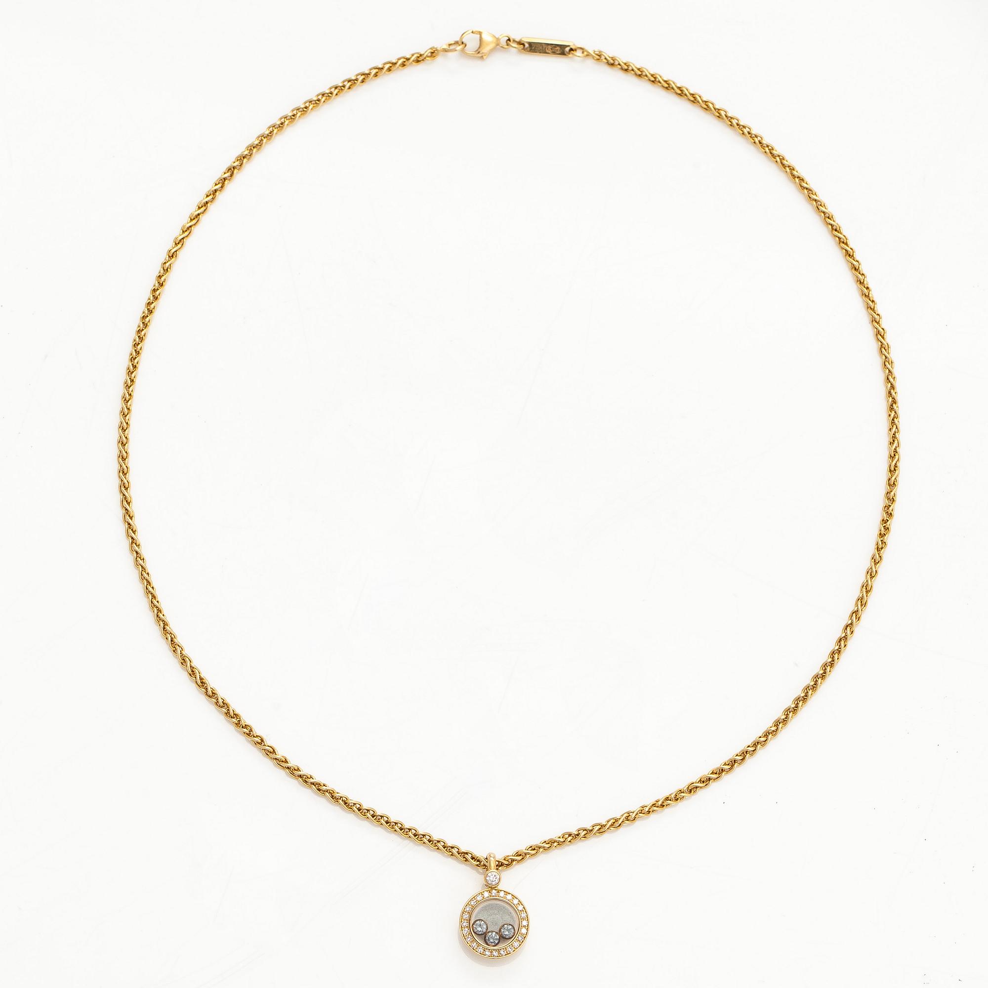Chopard, an 18K gold 'Happy Diamonds' necklace with brilliant-cut diamonds.