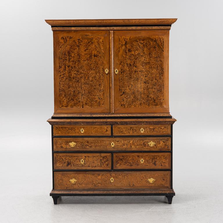 A burr alder, elm, and gilt-brass mounted late Baroque cabinet, first part of the 18th century.