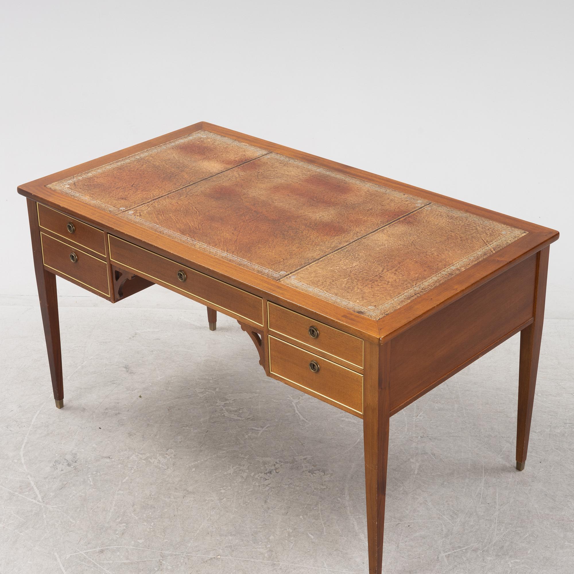 A Gustavian style writing desk and chair, 20th century.