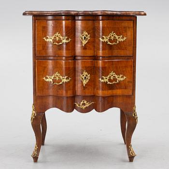 A Rococo-style chest of drawers, 19th century.