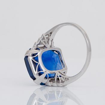 An unheated 11.27 ct Ceylon sapphire and baguette-cut diamond ring. Total carat weight of diamonds 0.70 cts.