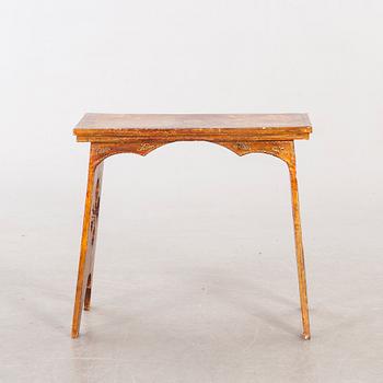 An mid 20th century wood table from Paoletti, Firenze Italy.