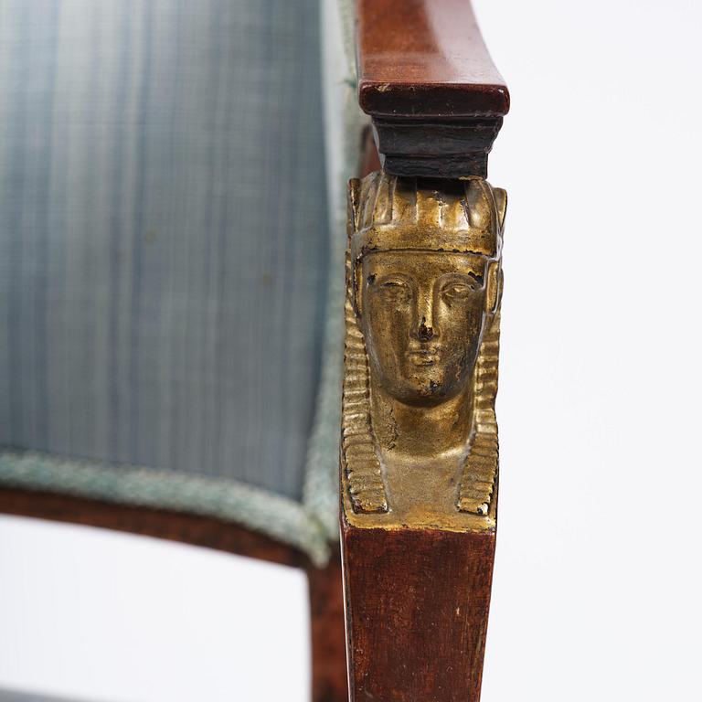 A pair of late Gustavian mahogny armchairs.