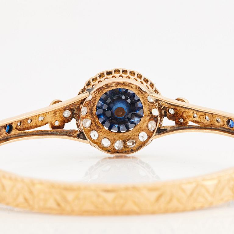 A blue paste and rose cut bangle, 19th century.