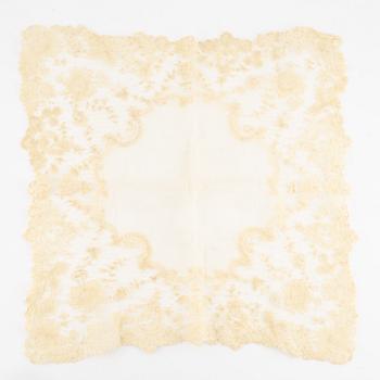 A ring in 18K white gold set with a yellow faceted tourmaline and rose-cut diamonds.