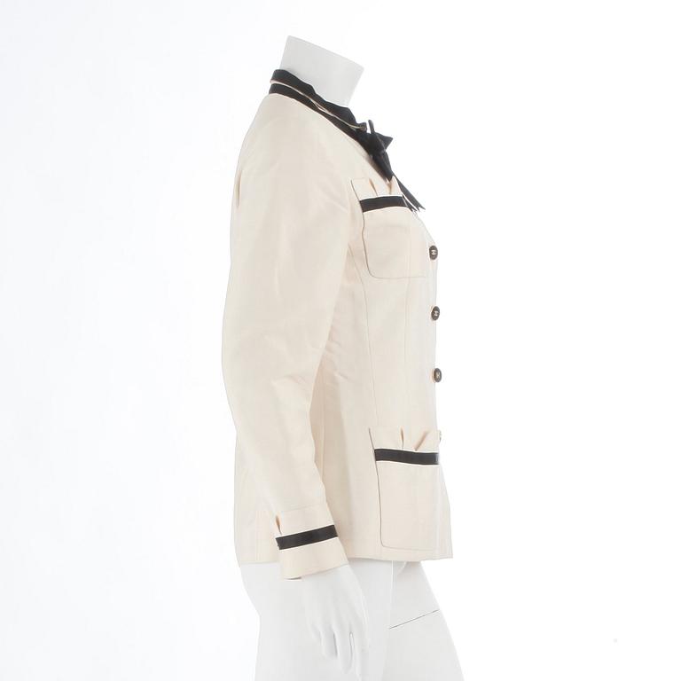 CHANEL, a black and white silk jacket.