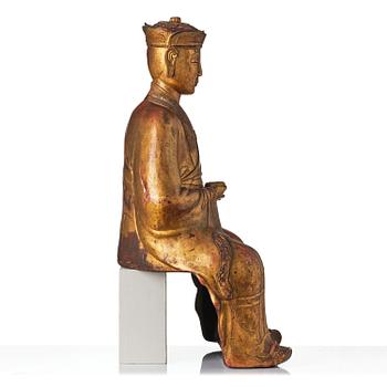 A large gilt lacquer figure of a deity, Vietnam, 19th century.