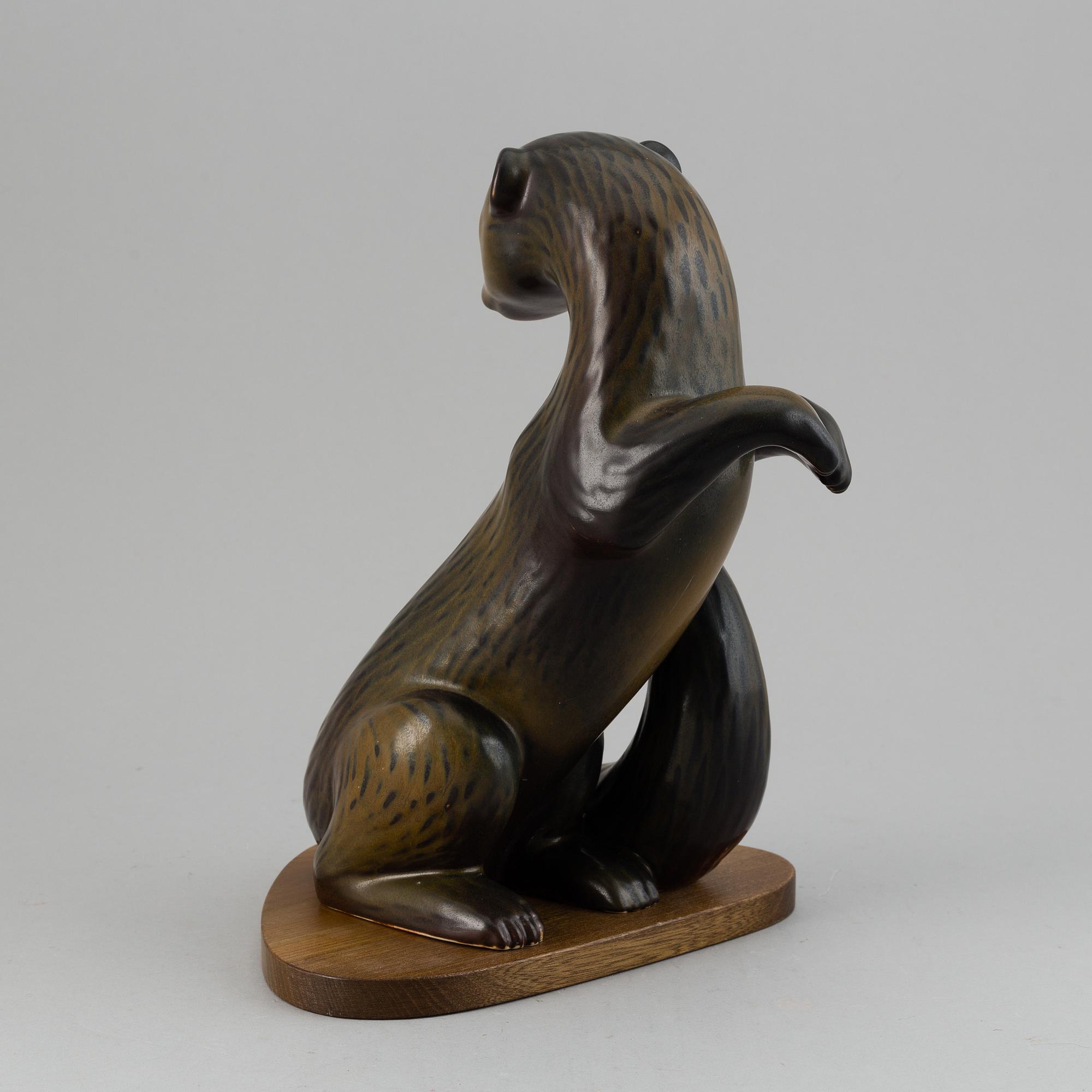 GUNNAR NYLUND, a stoneware sculpture of an otter, Rörstrand, Sweden.