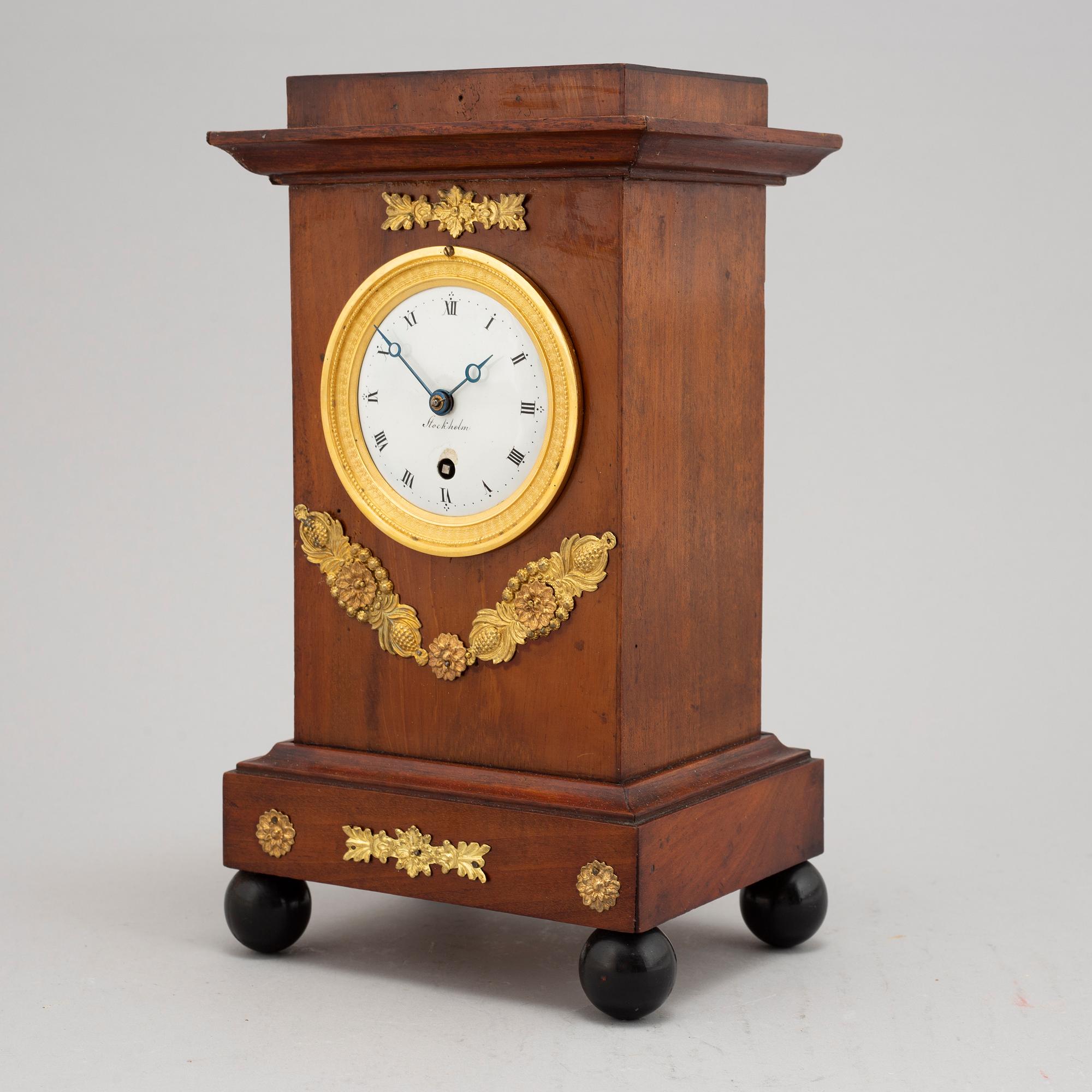 An Empire mantel clock, early 19th Century.