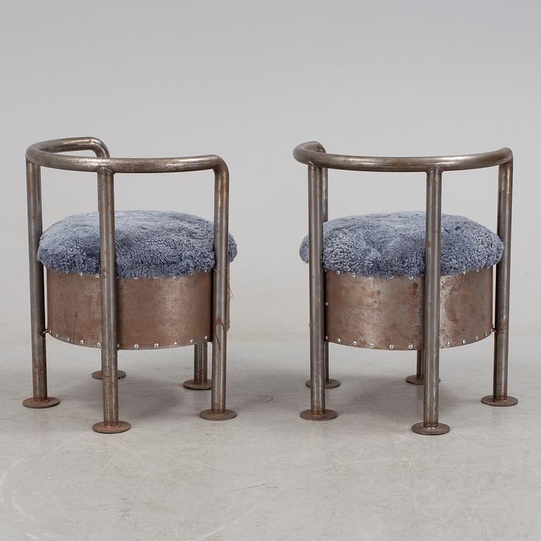 A pair of steel chairs by Arpad Földessy, 21st Century.