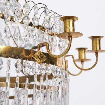 A late Gustavian thirteen-light gilt brass and cut glass chandelier, Stockholm, late 18th century.
