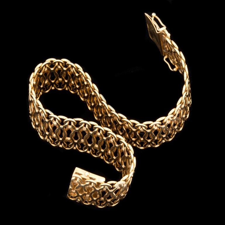 ARMLÄNK, 18 k guld, x-länk, Sahlgrens Guldsmide, Västerhaninge, 1969. Vikt ca 22,5 g.