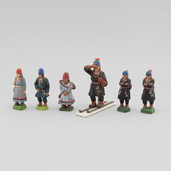 Six wooden figurines by Lars Enarsson, signed L.E.