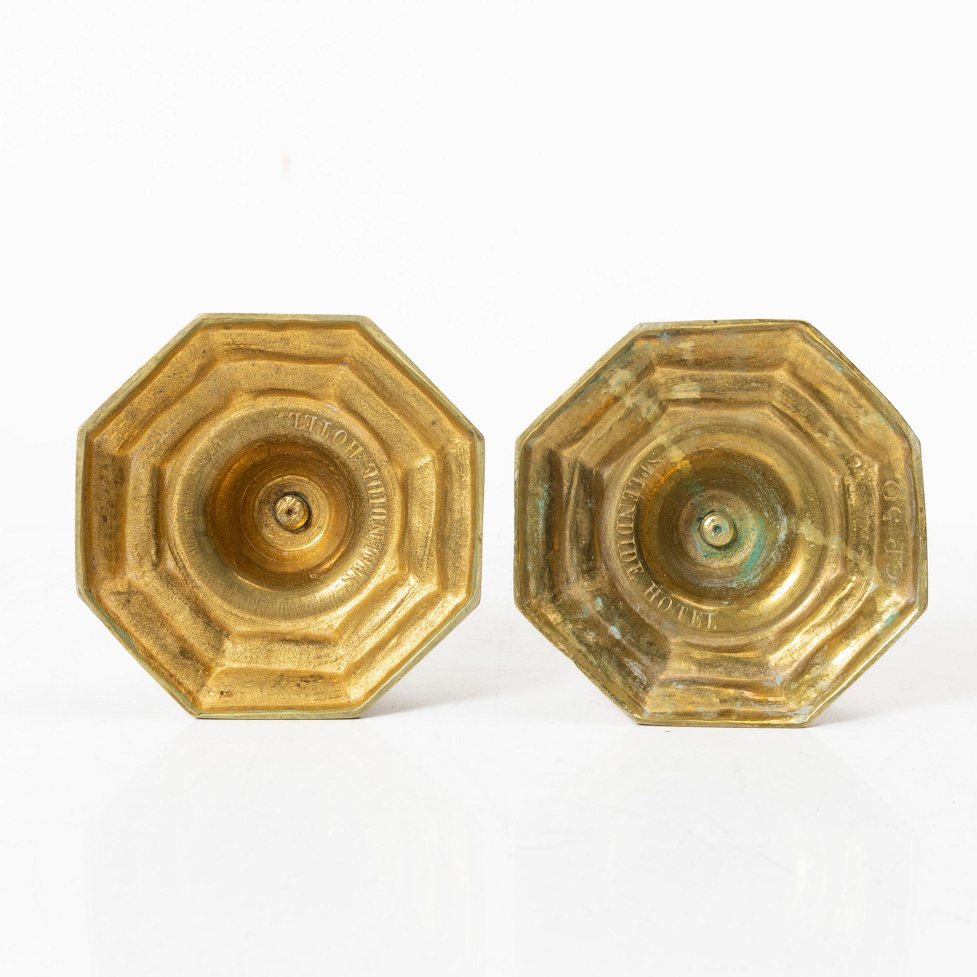 A pair of Louis XVI-style brass candle sticks, first half of the 20th century.