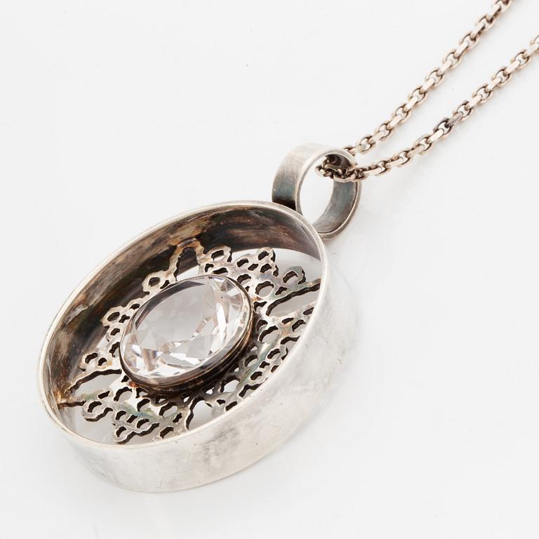 Bangle, ring and necklace, silver with colourless stones.